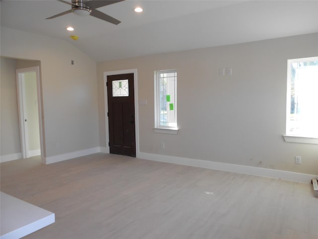 entryway featuring ceiling fan, light hardwood / wood-style flooring, and vaulted ceiling