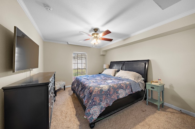 carpeted bedroom with ceiling fan, ornamental molding, and a textured ceiling