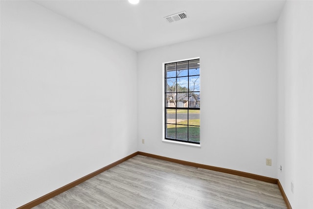 unfurnished room featuring light hardwood / wood-style flooring