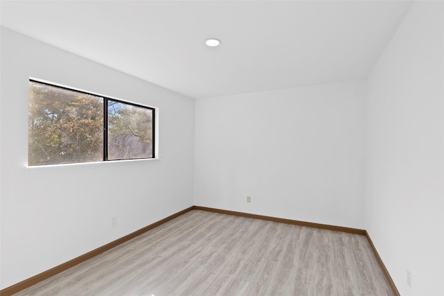 spare room featuring light hardwood / wood-style flooring