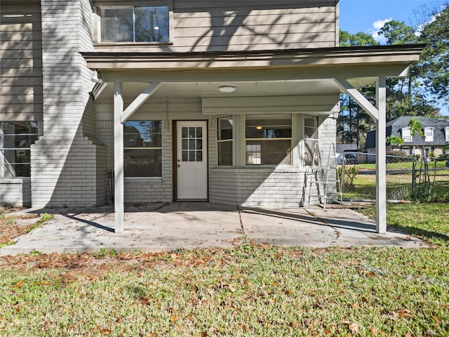 doorway to property with a patio area