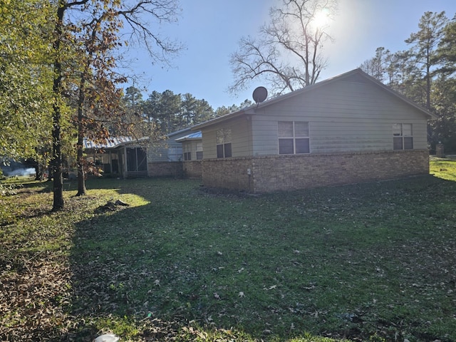 view of property exterior featuring a yard