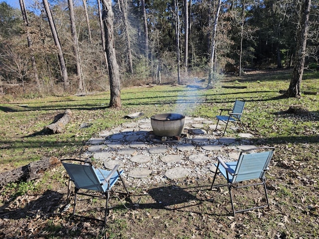 view of community with a yard and a patio