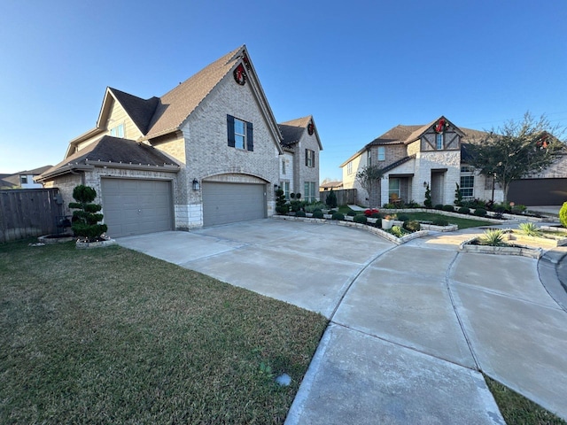 view of front facade with a front yard and a garage