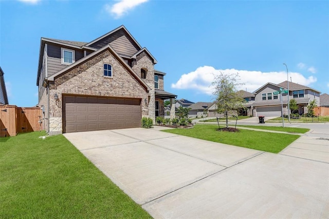 view of front of property featuring a garage and a front yard