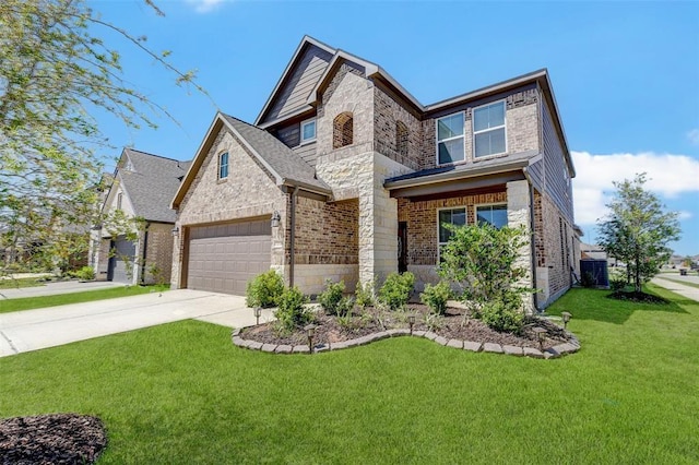 view of front of home featuring a front yard and a garage