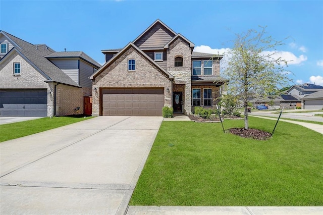 view of front facade with a garage and a front lawn