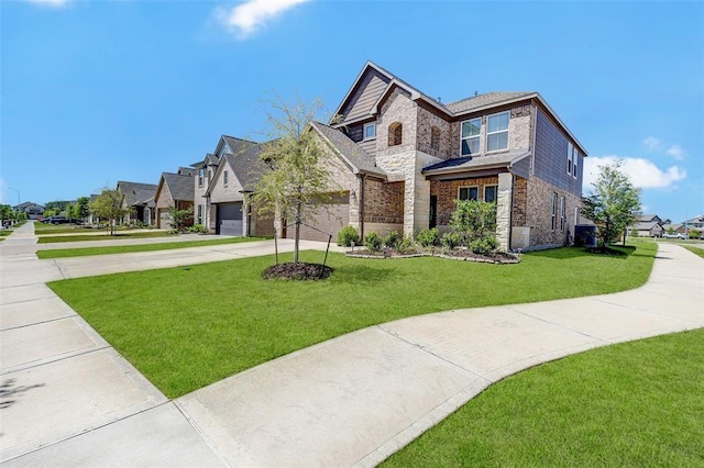 view of front of home featuring a front yard and a garage