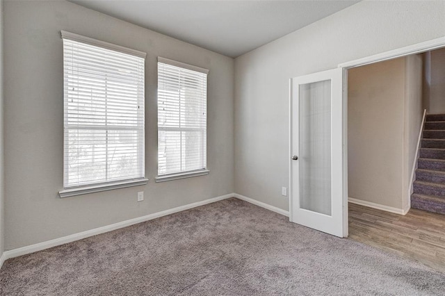 unfurnished bedroom with light colored carpet