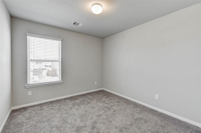 spare room with light colored carpet