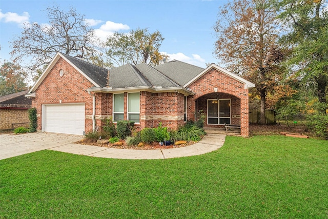 view of front of house featuring a garage and a front yard