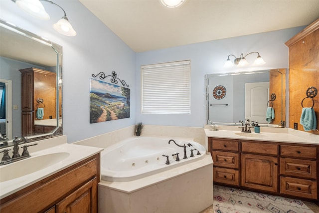 bathroom featuring vanity, vaulted ceiling, and tiled tub