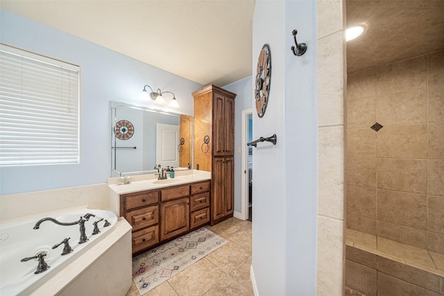 bathroom with tile patterned floors, vanity, and shower with separate bathtub