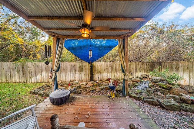 view of patio / terrace with a deck and ceiling fan