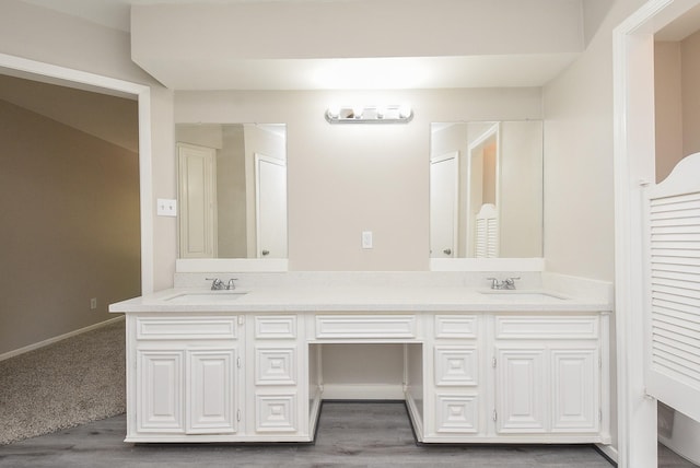 bathroom with vanity and wood-type flooring