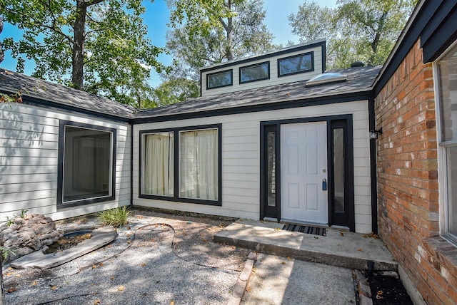 property entrance with a patio area