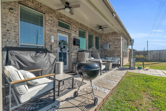 view of patio with outdoor lounge area and ceiling fan