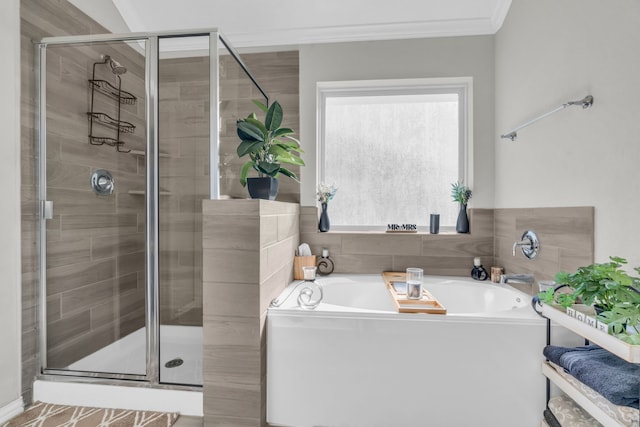 bathroom featuring shower with separate bathtub