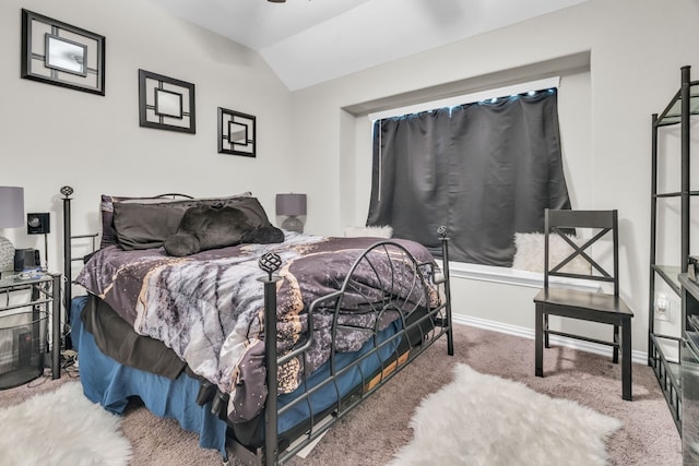 bedroom featuring carpet and vaulted ceiling