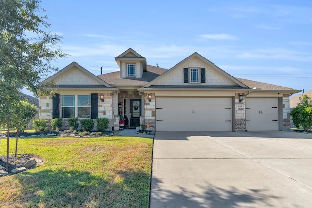 craftsman-style house featuring a front yard and a garage