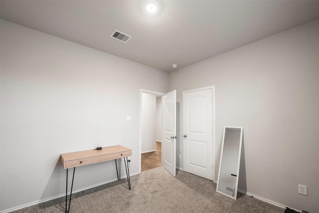 home office featuring dark carpet