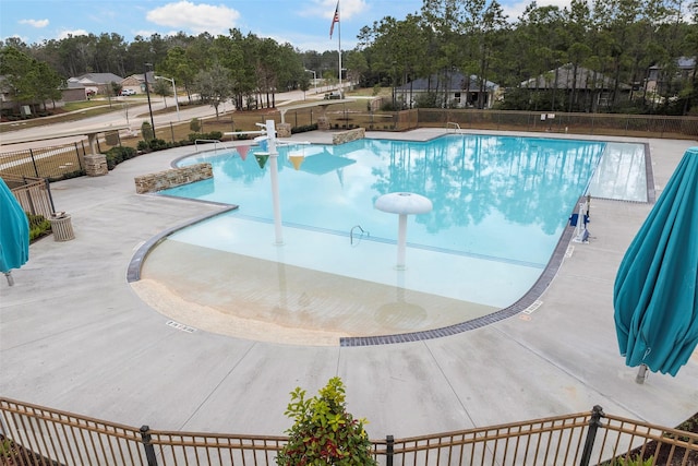 view of swimming pool with a patio