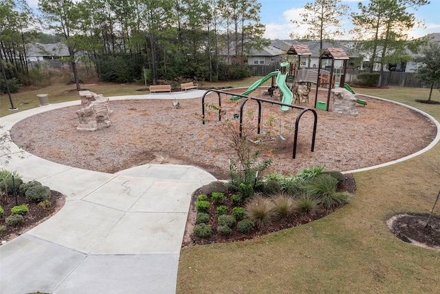 view of playground with a lawn