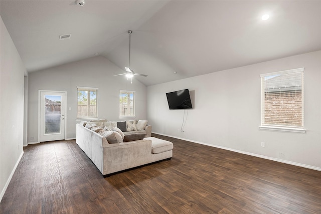 living room featuring ceiling fan, dark hardwood / wood-style flooring, and vaulted ceiling