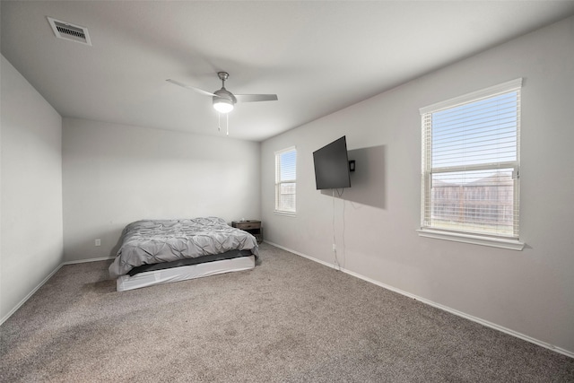 carpeted bedroom featuring ceiling fan