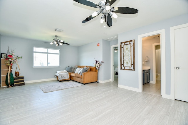 living area featuring ceiling fan