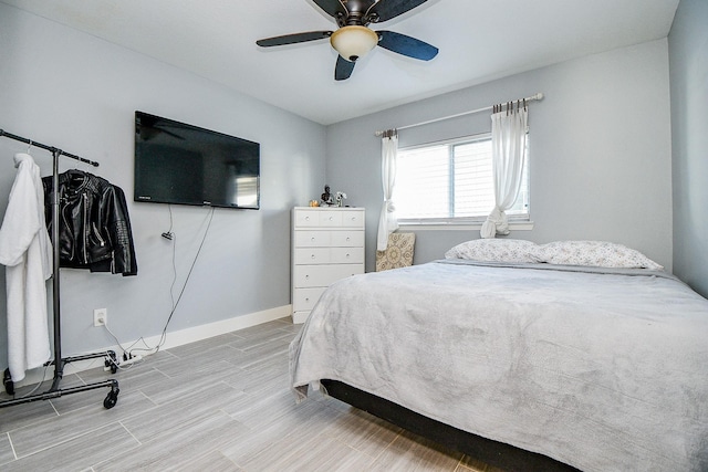 bedroom featuring ceiling fan and light hardwood / wood-style floors