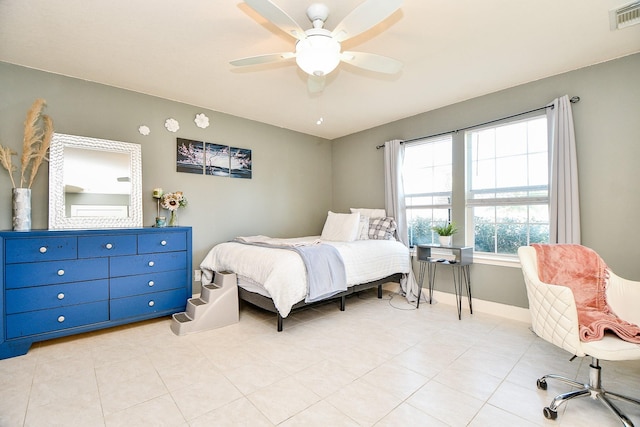 tiled bedroom with ceiling fan