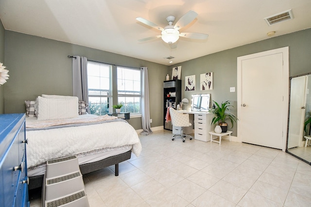 tiled bedroom featuring ceiling fan