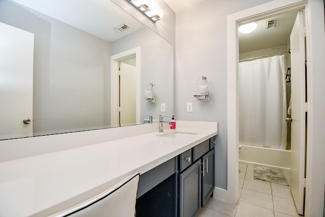 full bathroom with toilet, tile patterned flooring, vanity, and shower / tub combo with curtain