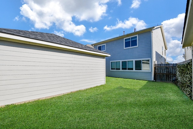 back of house with a lawn