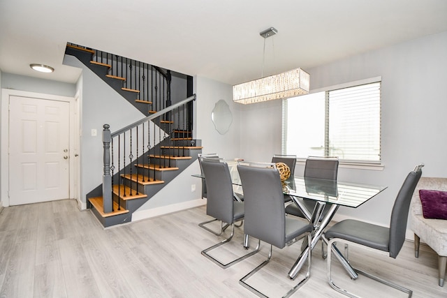 dining area featuring light wood-type flooring