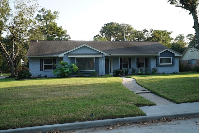 ranch-style house featuring a porch and a front lawn