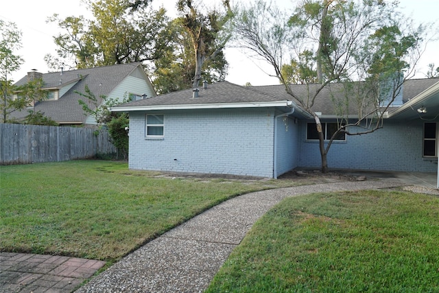 view of property exterior featuring a yard