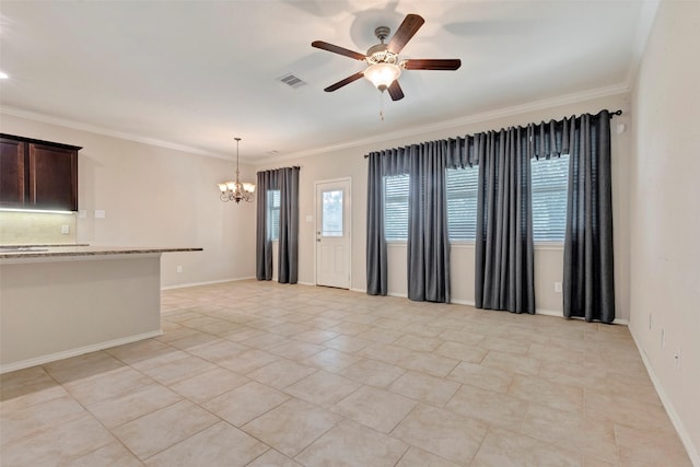 empty room featuring ceiling fan with notable chandelier, light tile patterned floors, and crown molding