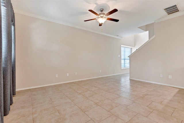 tiled empty room with ceiling fan and crown molding