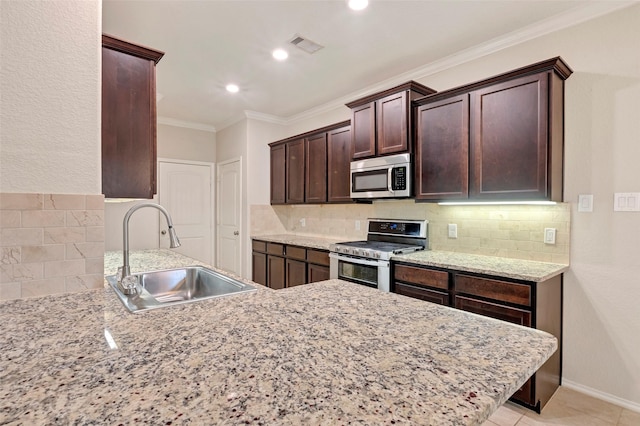 kitchen with sink, stainless steel appliances, tasteful backsplash, kitchen peninsula, and ornamental molding