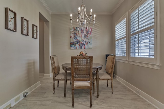 dining room featuring a chandelier and crown molding