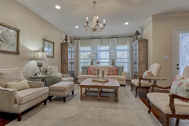 living area with plenty of natural light, ornamental molding, and an inviting chandelier