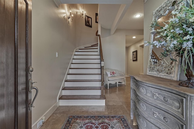 entryway featuring a textured ceiling