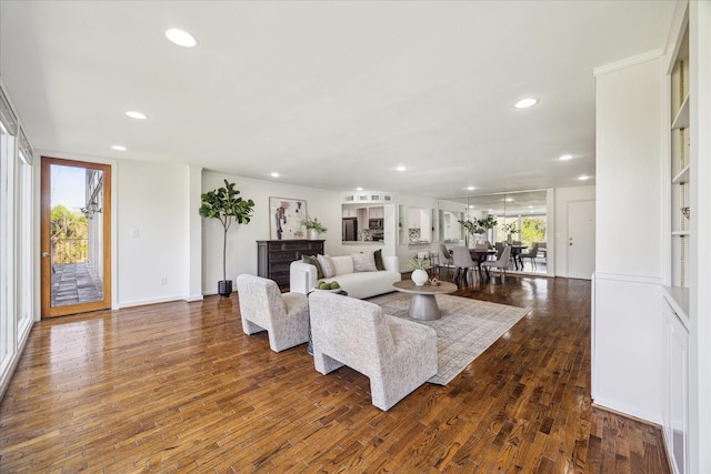 living room with dark hardwood / wood-style flooring and plenty of natural light