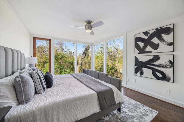 bedroom with ceiling fan and dark hardwood / wood-style floors