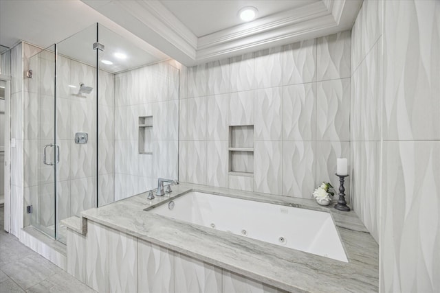 bathroom featuring crown molding, plus walk in shower, and tile walls