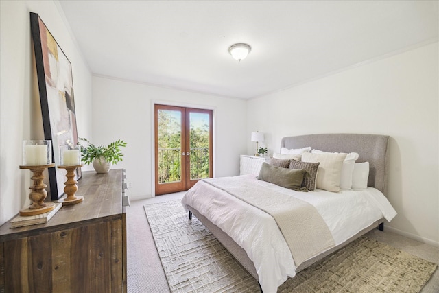 bedroom with carpet flooring, french doors, and ornamental molding