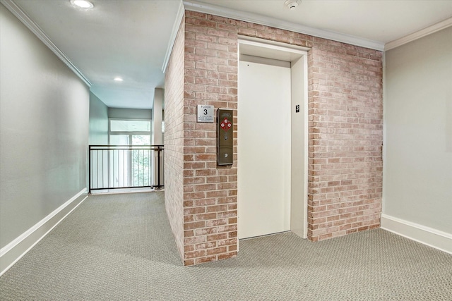 hallway with light colored carpet, elevator, crown molding, and brick wall