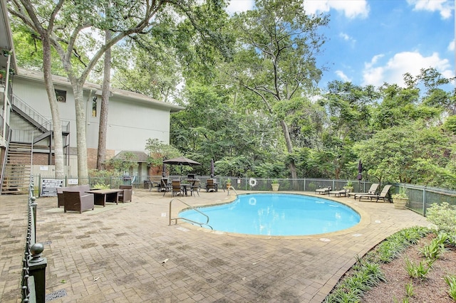 view of pool featuring outdoor lounge area and a patio area